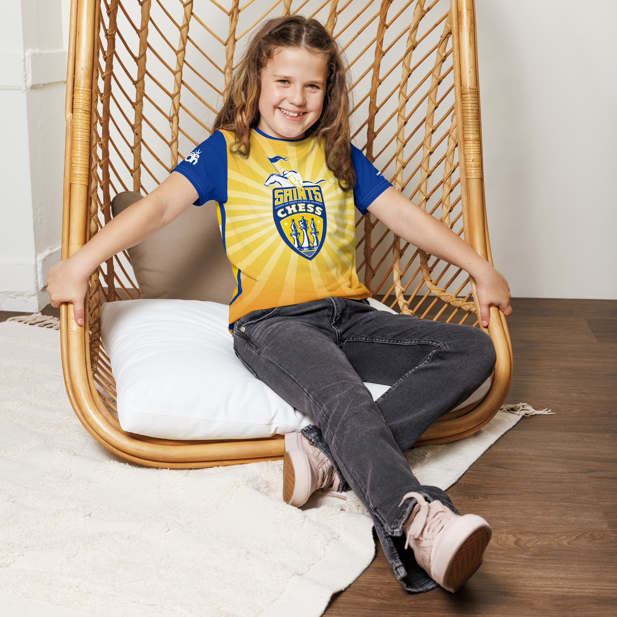 Model wearing a custom QP Saints Chess yellow-and-blue tee